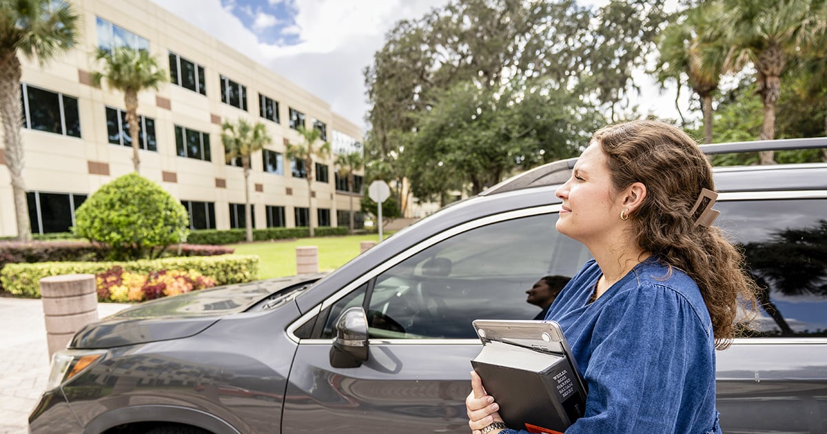 law student looking at buidling