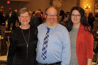 Exoneree Gilbert Poole (center) with Cooley Law School Distinguished Professor Emeritus Marla Mitchell -Cichon and Lori Montgomery during Michigan Lawyers Weekly’s 2024 Class of Influential Women of Law Induction. Poole was exonerated by Cooley’s Innocence Project while Mitchell-Cichon served as the clinic’s director. 
